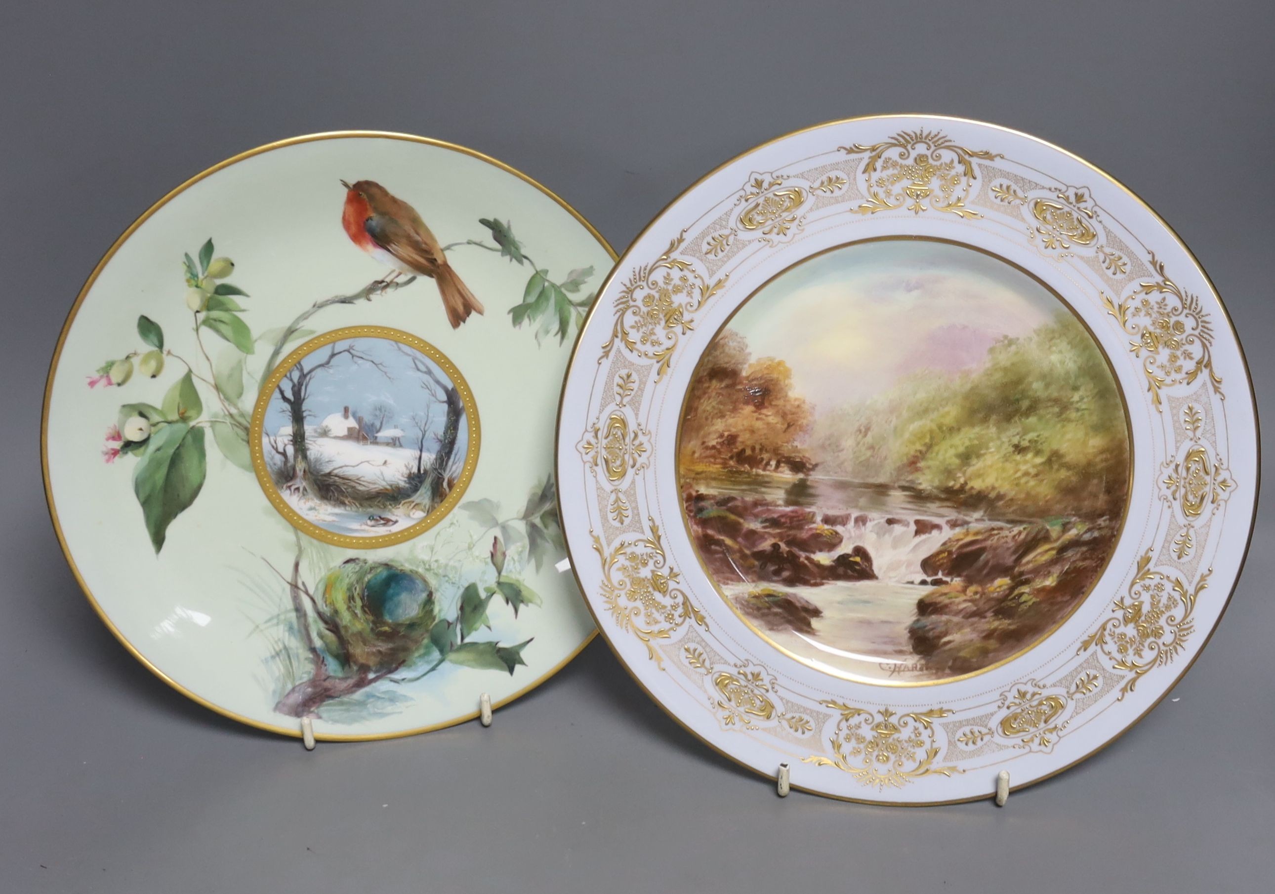 A Royal Doulton cabinet plate, painted with 'The Still Pond, Bettys y Coed', signed, 26cm and a Minton cabinet plate painted with a wintery landscape with a cottage, 24cm